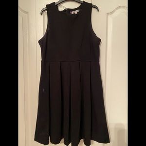 Black sleeveless skater dress with pockets